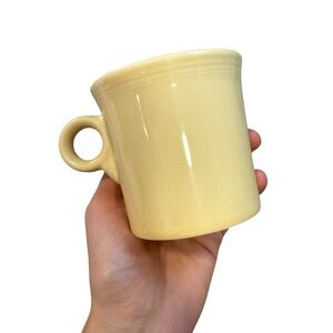 Set of nine vintage light yellow/cream to wear ring handle mugs